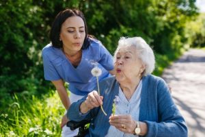 Seniors gardening outdoors in a sunny Leicester garden during summer